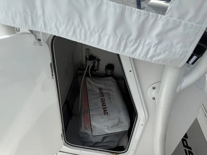 Slide: The Image of 2020 Sportsman Heritage 231 Center Console storage with safety gear bag. - 13