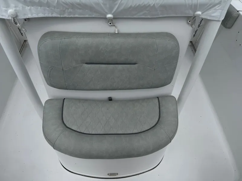 Slide: The Image of 2020 Sportsman Heritage 231 Center Console boat seat, gray upholstery, top view. - 14