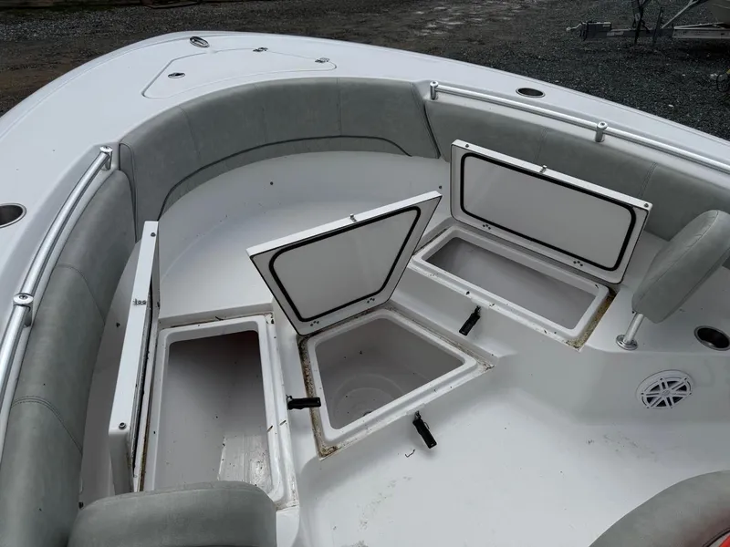 Slide: The Image of 2020 Sportsman Heritage 231 Center Console boat with open storage compartments. - 15