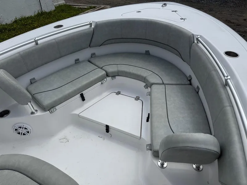 Slide: The Image of 2020 Sportsman Heritage 231 Center Console boat with gray cushioned seating area. - 16