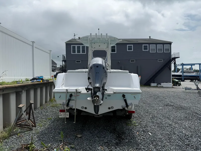 Slide: The Image of 2020 Sportsman Heritage 231 Center Console boat parked outdoors on gravel. - 5