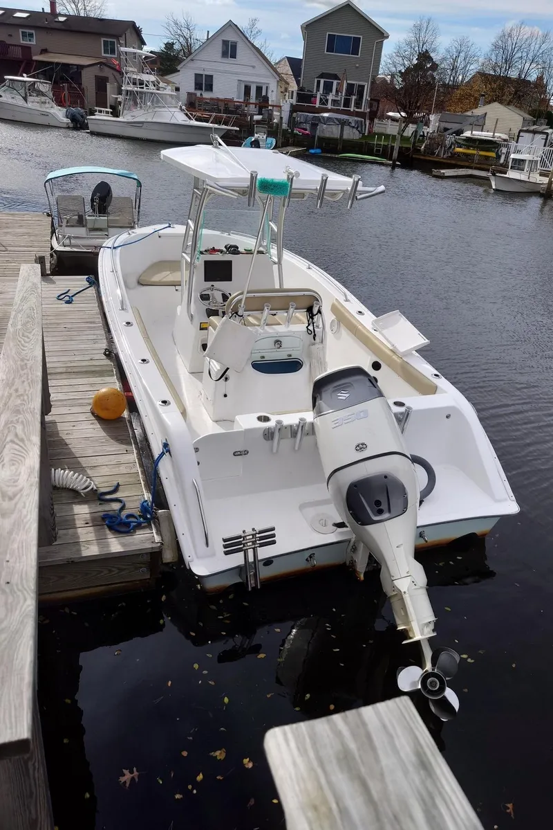 Slide: The Image of 2020 Cape Horn 22 OS boat docked by waterfront homes. - 2