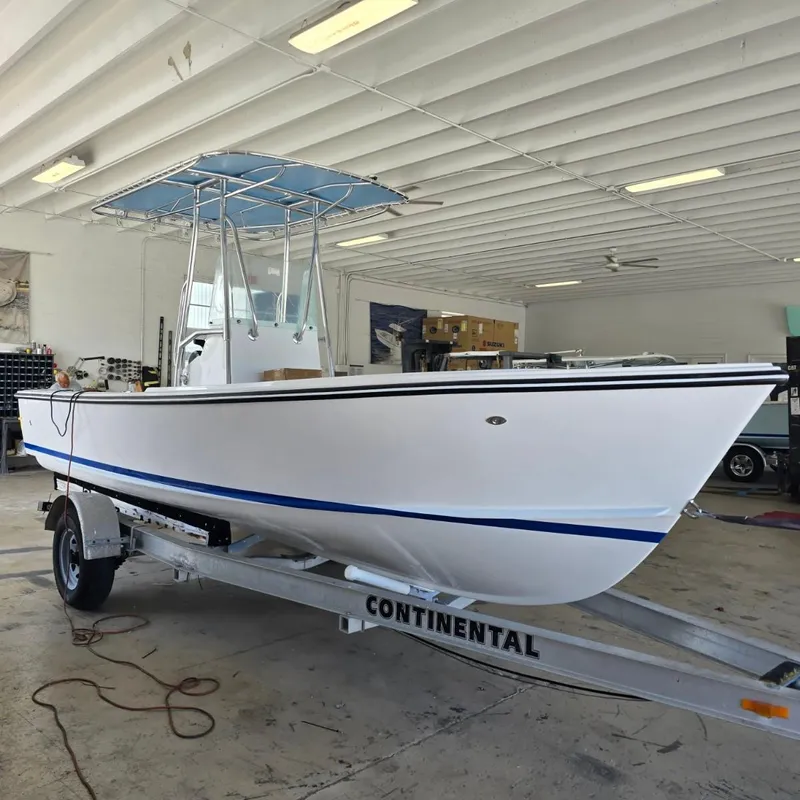 Slide: The Image of 2026 Albury Brothers 20 boat navigating through ocean waves. - 2