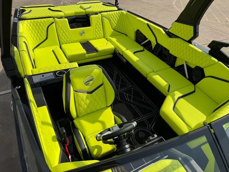 Slide: The Image of 2025 Tigé 24RZX boat interior with vibrant lime green seating and modern design. - 10