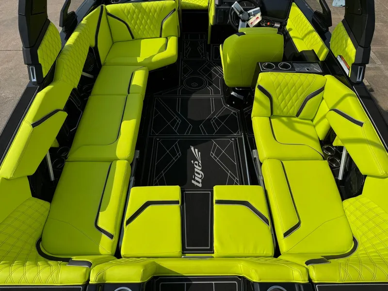 Slide: The Image of 2025 Tigé 24RZX boat interior with vibrant lime green seating and modern design. - 11