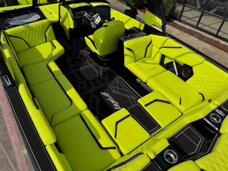 Slide: The Image of 2025 Tigé 24RZX boat interior with vibrant lime green seating and modern design. - 12