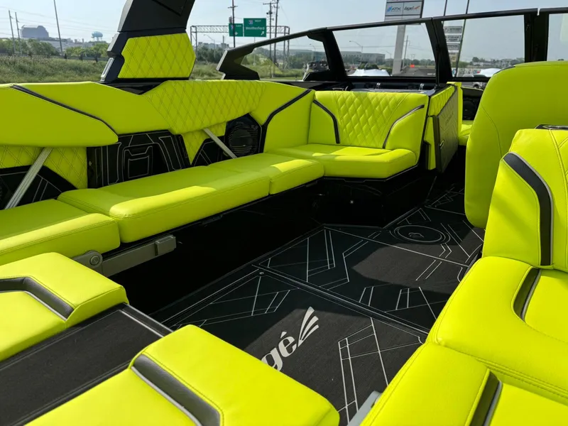 Slide: The Image of Luxurious interior of 2025 Tigé 24RZX boat with vibrant lime green seating. - 15