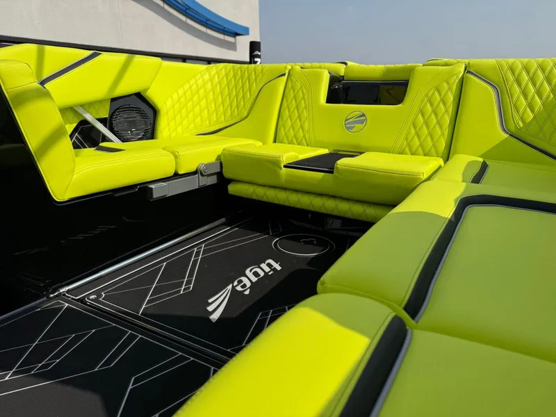 Slide: The Image of 2025 Tigé 24RZX boat interior with vibrant lime green seating and modern design. - 20
