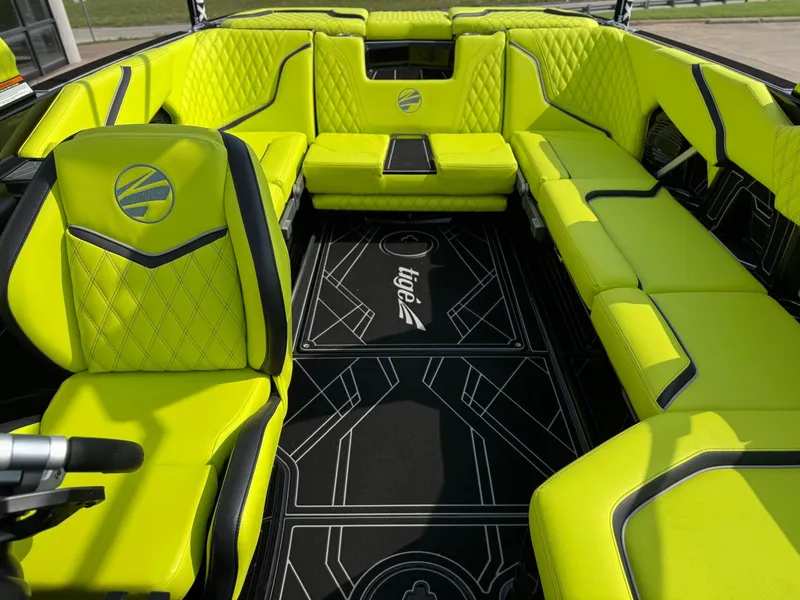 Slide: The Image of Luxurious interior of 2025 Tigé 24RZX boat with vibrant lime green seating. - 8