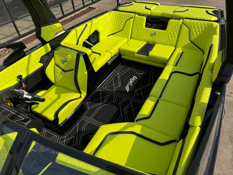 Slide: The Image of 2025 Tigé 24RZX boat interior with vibrant lime green seating and modern design. - 9