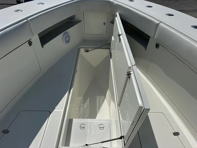 Slide: The Image of 2013 SeaVee 390B boat interior with open storage compartment. - 18