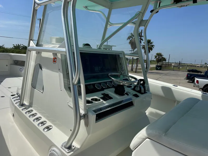 Slide: The Image of 2013 SeaVee 390B boat console with steering wheel and navigation controls. - 6