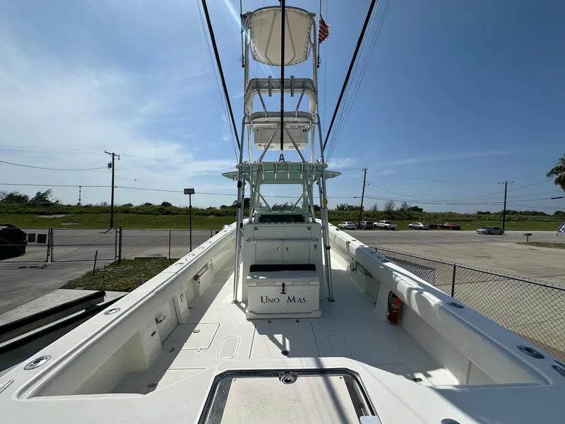Slide: The Image of 2013 SeaVee 390B boat with tower, docked in a sunny marina. - 9