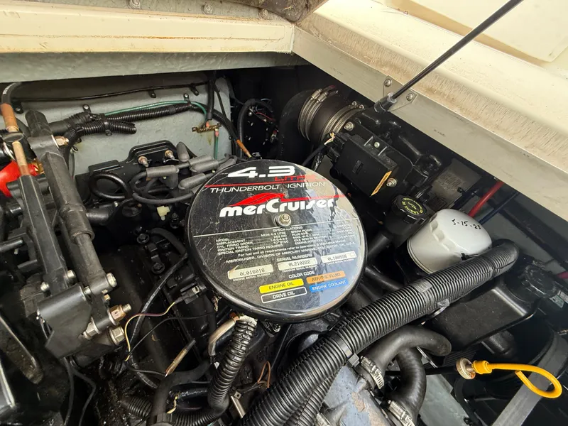 Slide: The Image of Engine compartment of a 1997 Sea Ray 290 Sundancer with MerCruiser 4.3L engine. - 16