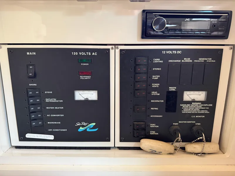 Slide: The Image of Electrical control panel of a 1997 Sea Ray 290 Sundancer boat. - 7
