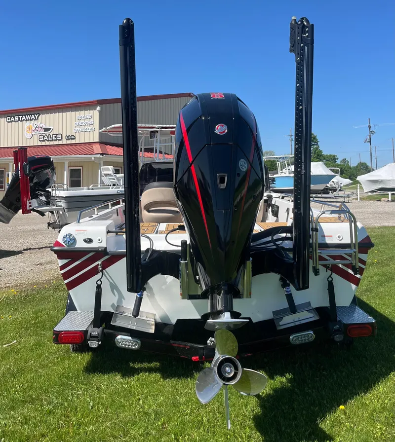 Slide: The Image of Charger VMAG 2010 boat, 2022 model, displayed outdoors with motor and propeller visible. - 4