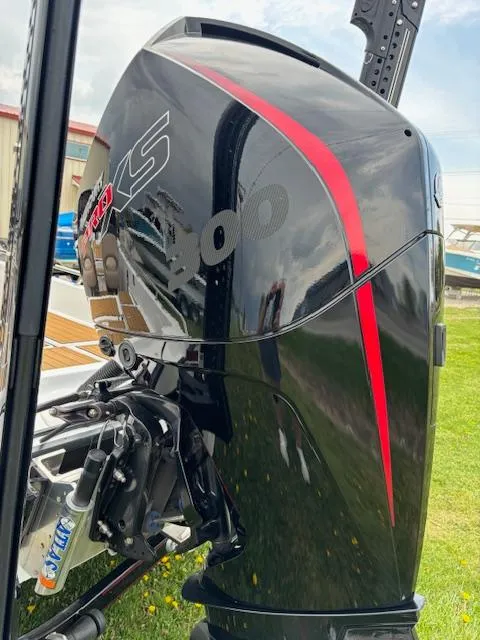 Slide: The Image of 2022 Charger VMAG 2010 outboard motor with sleek black and red design. - 5