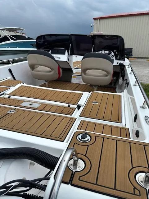 Slide: The Image of 2022 Charger VMAG 2010 boat interior with wood paneling and dual seats. - 9