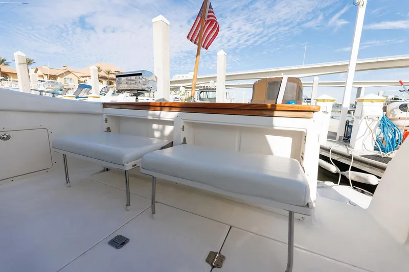 Slide: The Image of 2003 Regal Commodore 3880 boat deck with seating and American flag. - 32