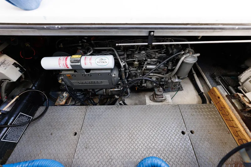 Slide: The Image of Engine compartment of a 2003 Regal Commodore 3880 boat, showcasing mechanical components. - 36