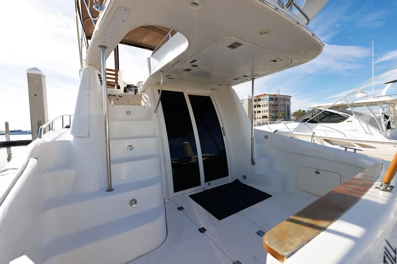 Slide: The Image of 2003 Regal Commodore 3880 yacht with sleek white deck and modern design. - 39