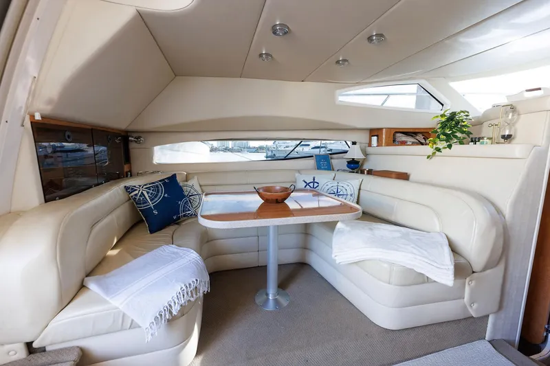 Slide: The Image of Luxurious interior of 2003 Regal Commodore 3880 yacht with plush seating and elegant decor. - 42