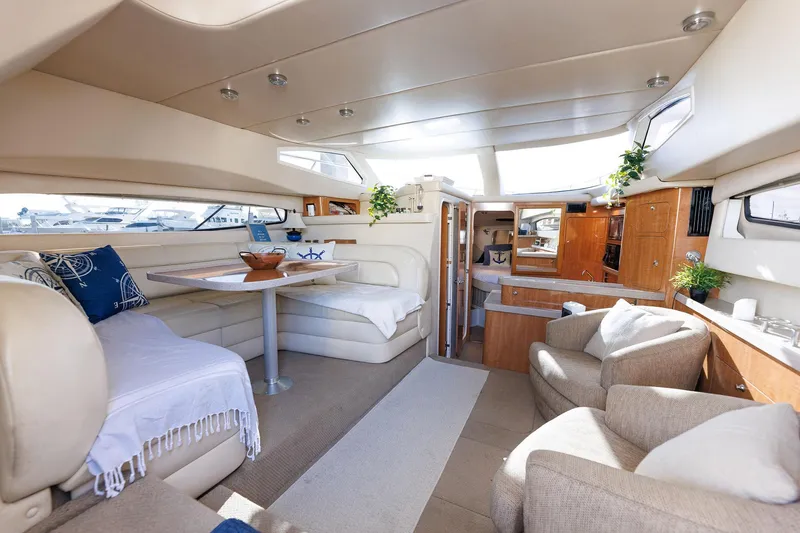 Slide: The Image of Luxurious interior of 2003 Regal Commodore 3880 yacht with elegant seating and dining area. - 44