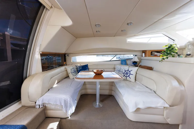 Slide: The Image of Luxurious interior of 2003 Regal Commodore 3880 yacht with elegant seating and table. - 45