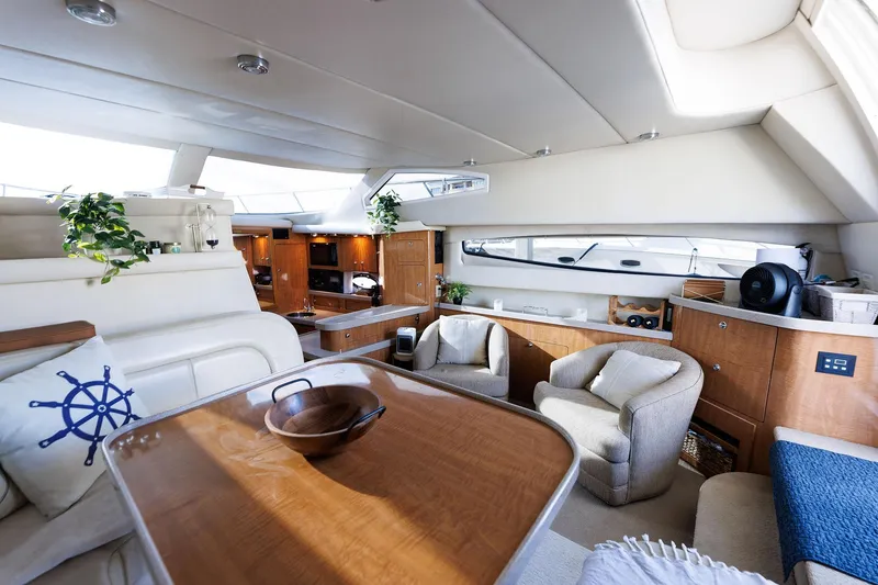 Slide: The Image of Luxurious interior of 2003 Regal Commodore 3880 yacht with elegant seating and wooden accents. - 46