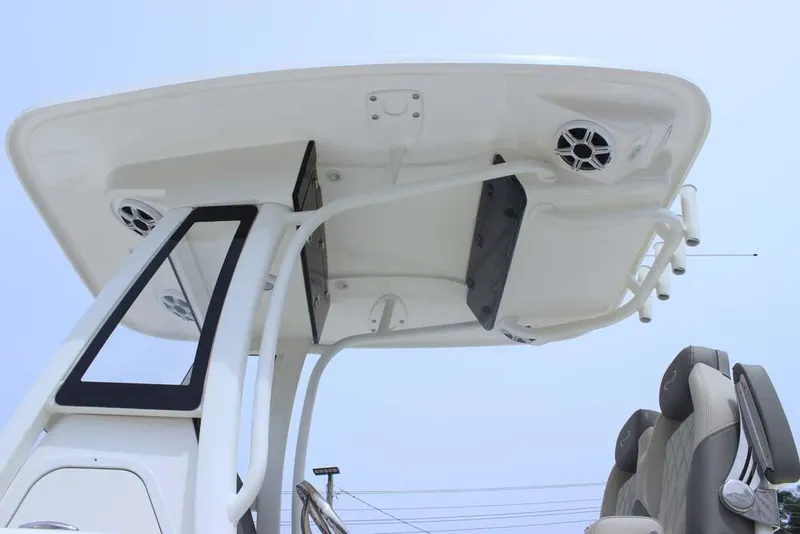 Slide: The Image of 2025 Key West 239 FSR boat T-top with speakers and seating, viewed from below. - 11