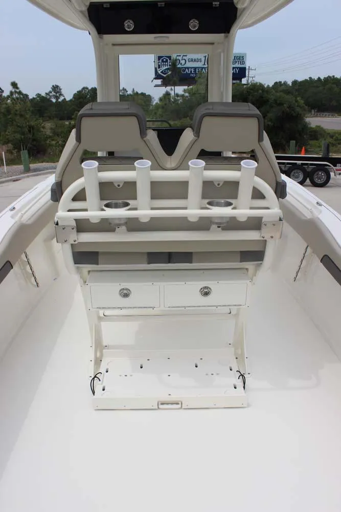 Slide: The Image of 2025 Key West 239 FSR boat interior with rod holders and storage drawers. - 16