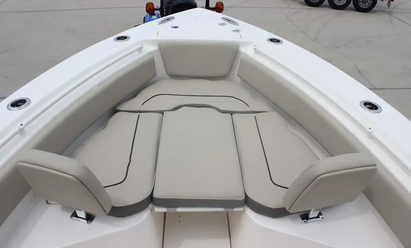 Slide: The Image of 2025 Key West 239 FSR boat with cushioned seating in the bow area. - 18