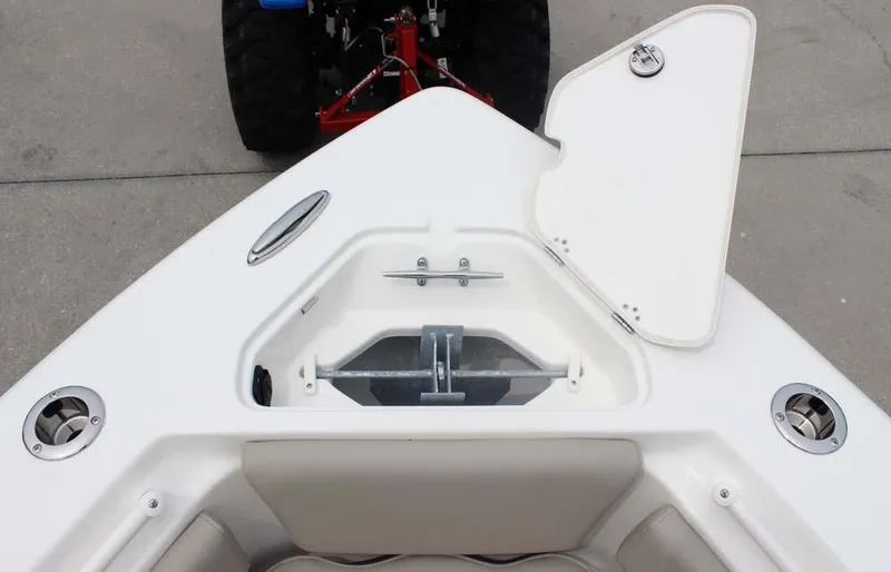 Slide: The Image of 2025 Key West 239 FSR boat bow with open anchor locker and seating area. - 20