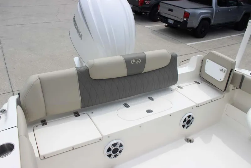 Slide: The Image of 2025 Key West 239 FSR boat interior with cushioned seating and storage compartments. - 28