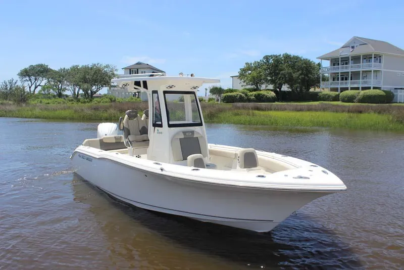 Slide: The Image of 2025 Key West 239 FSR boat on calm water near residential area. - 3