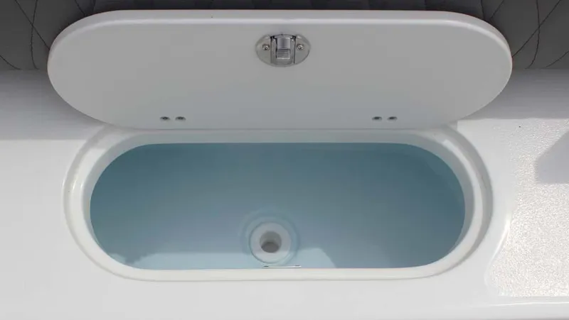 Slide: The Image of Livewell on 2025 Key West 239 FSR boat, open lid, white interior. - 31