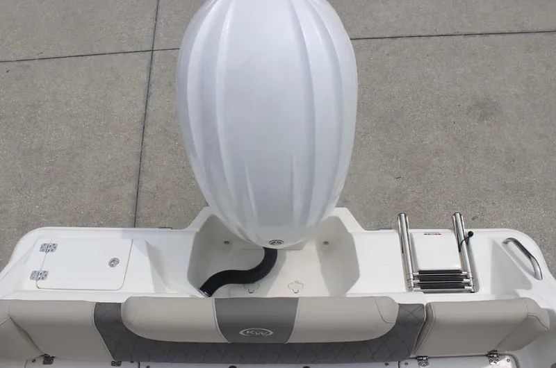 Slide: The Image of 2025 Key West 239 FSR boat stern view with engine and swim ladder. - 33