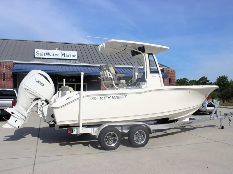 Slide: The Image of 2025 Key West 239 FSR boat on trailer outside SaltWater Marine dealership. - 4