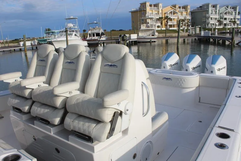 Slide: The Image of 2020 Invincible Center Cabin boat with luxurious seating and powerful engines docked at marina. - 6