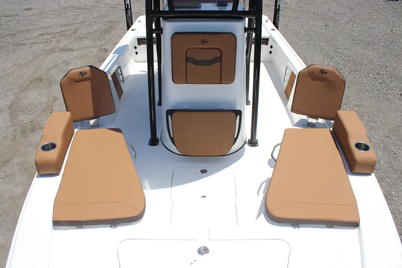 Slide: The Image of 2025 Sea Pro 230 Bay boat interior with tan seating and white deck. - 10