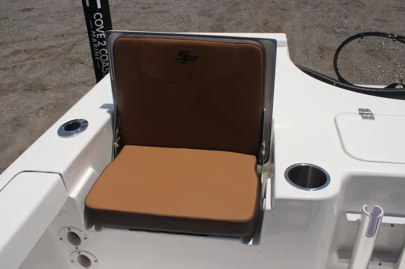 Slide: The Image of 2025 Sea Pro 230 Bay boat seat with brown cushion and cup holder. - 16