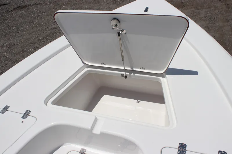 Slide: The Image of Open storage compartment on 2025 Sea Pro 230 Bay boat deck. - 6