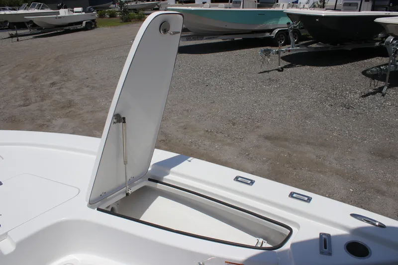 Slide: The Image of 2025 Sea Pro 230 Bay boat with open storage compartment on deck. - 7