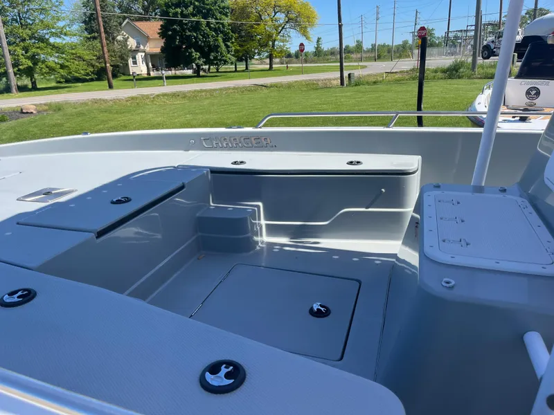 Slide: The Image of 2023 Charger 2230 L Sport boat interior with seating and storage compartments. - 10