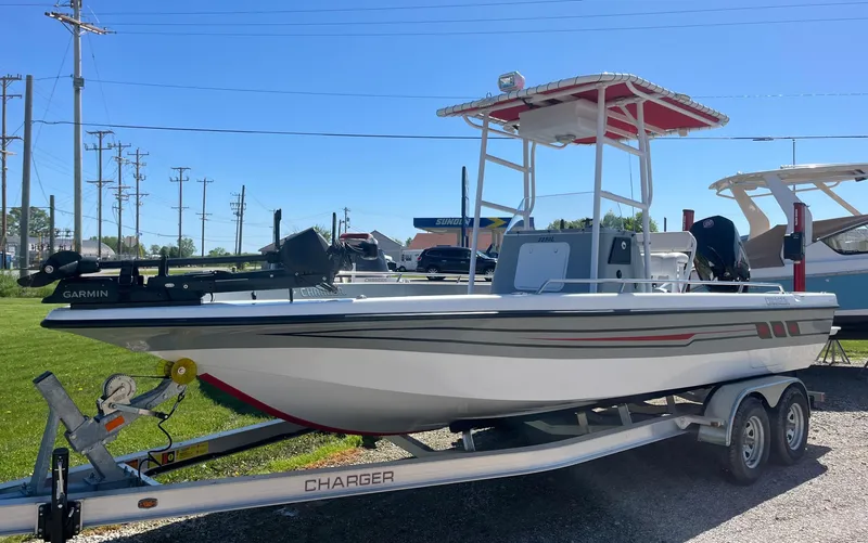 Slide: The Image of 2023 Charger 2230 L Sport boat on trailer, outdoor display. - 2