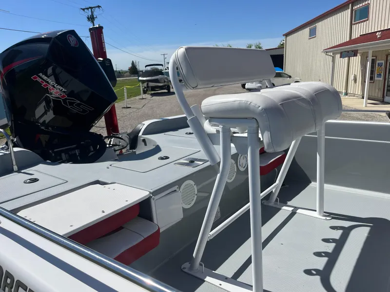 Slide: The Image of 2023 Charger 2230 L Sport boat with white seating and powerful outboard motor. - 6