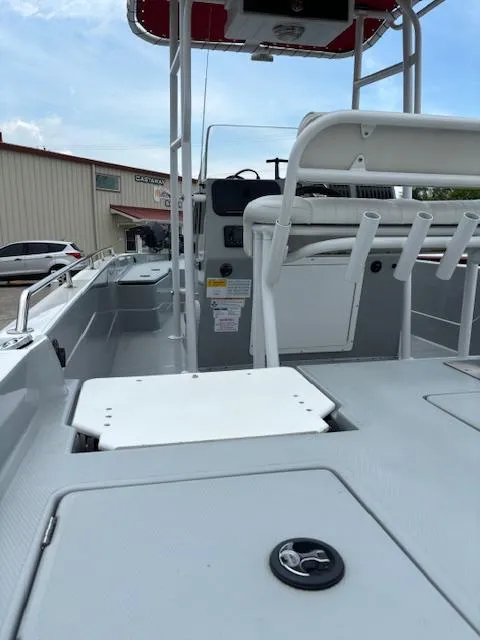 Slide: The Image of 2023 Charger 2230 L Sport boat interior with seating and control panel. - 8