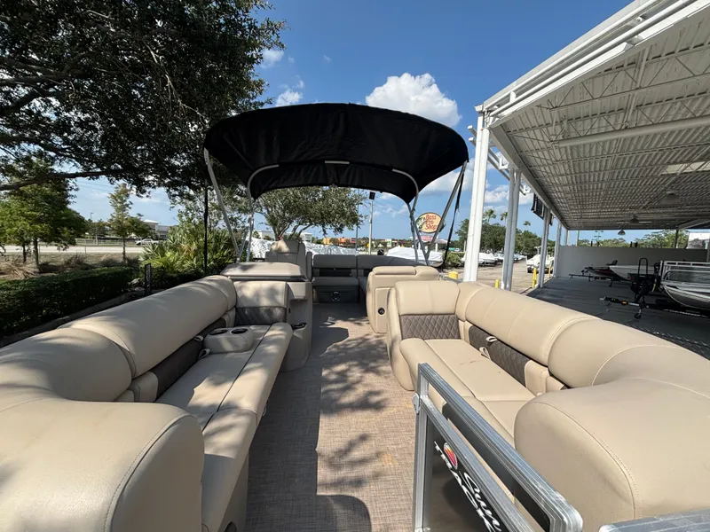 Slide: The Image of 2025 Sun Tracker Party Barge 20 DLX pontoon boat with spacious seating and canopy. - 2