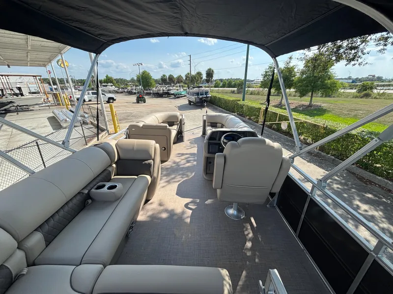 Slide: The Image of 2025 Sun Tracker Party Barge 20 DLX pontoon boat with spacious seating and canopy. - 3