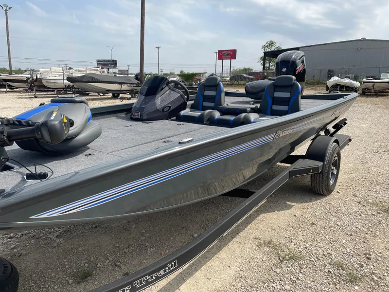 The Image of 2025 Ranger RT188P fishing boat with dual seats and motor, parked on a trailer. - 0